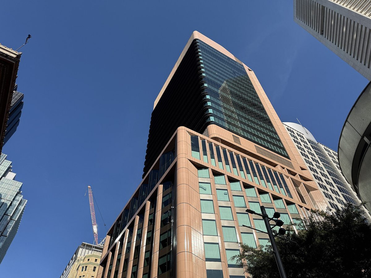 Glass office towers in an Australian financial district viewed from street level